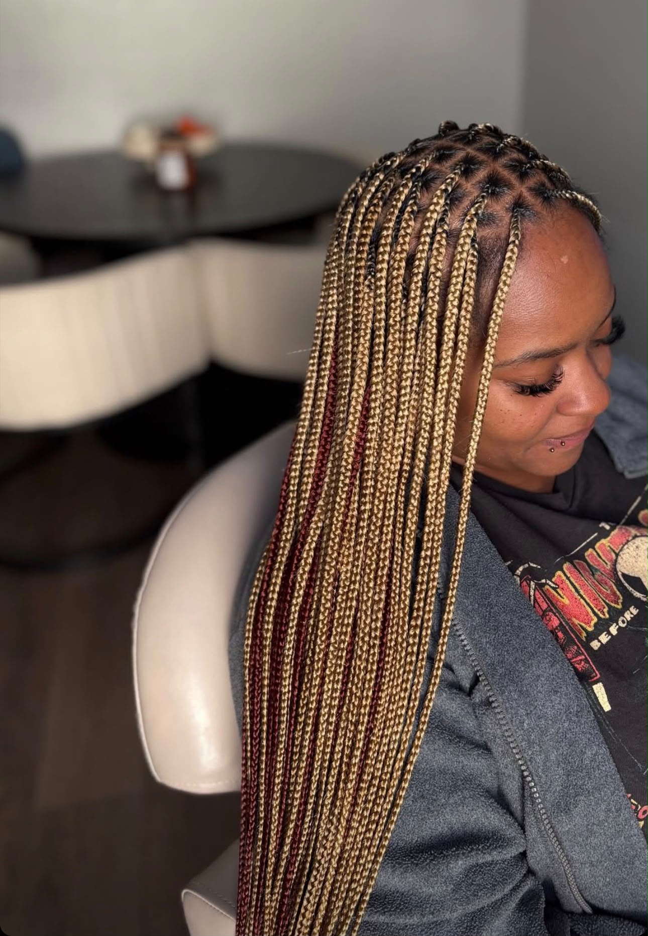 Clean parted knotless braids styled at Stella Braids and Hair Studio in Covina